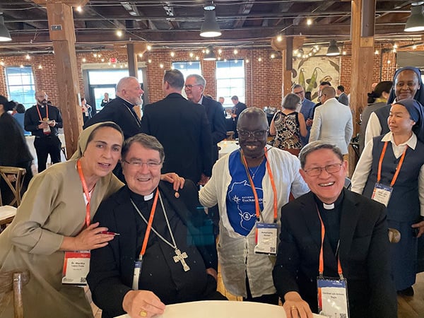 Antoinette-EC-Cardinal-Pierre-and-Cardinal-Tagle Our board president, Dr. Antoinette Mensah (in blue and white), had the privilege of meeting Cardinal Christophe Pierre (left) and Cardinal Luis Tagle (right).